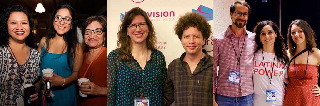 Image of smiling festival guests wearing badges and holding drinks